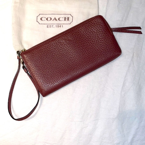 Coach Handbags - Coach wristlet wallet in burgundy.